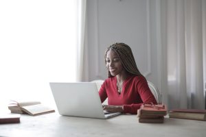 African American woman at her computer doing online therapy in Texas | Online counseling | Houston therapist | Natalie Mica LPC | 77006